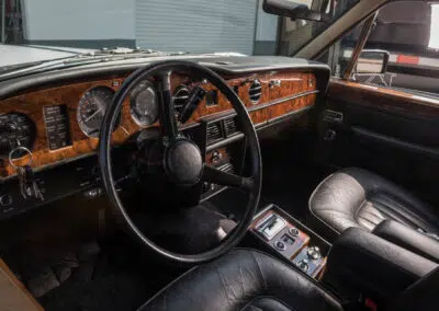 Rolls Royce black interior with wood trim.
