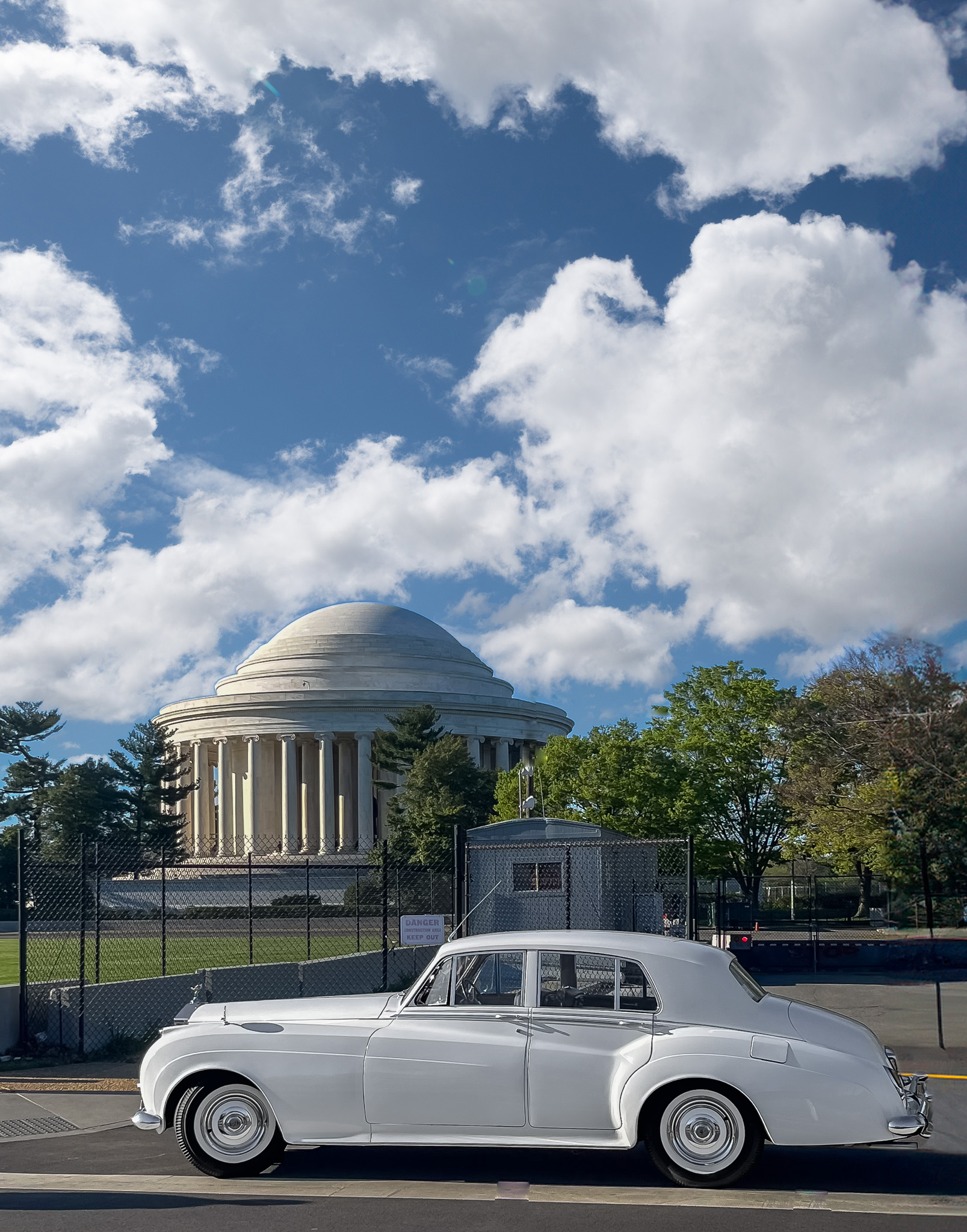 Photo of a white Rolls Royce in front of the Jefferson Memorial in Washington DC